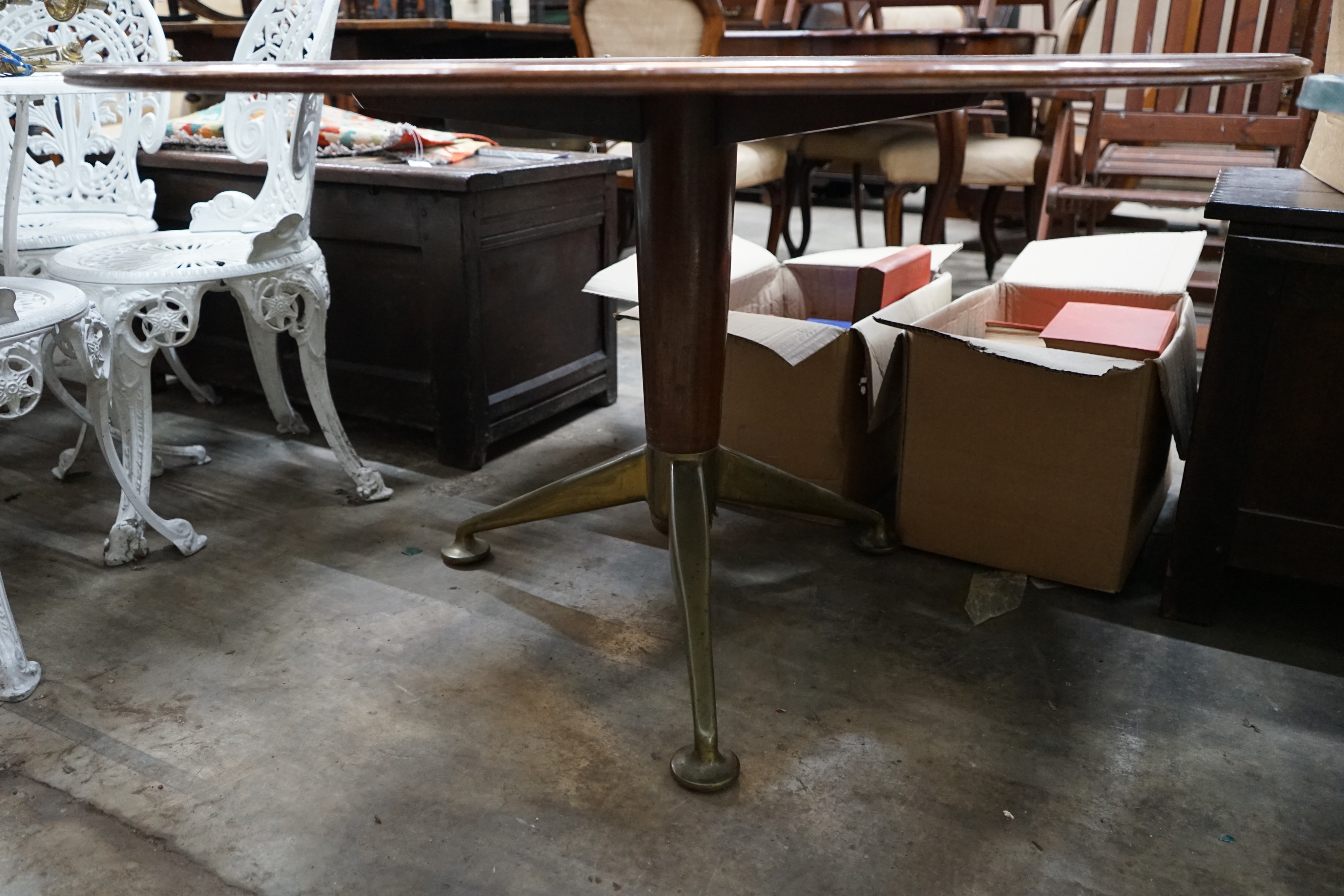 A mid century design circular centre table, on spoked metal base, width 122cm height 67cm